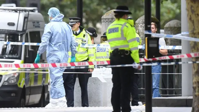 Investigators outside the museum