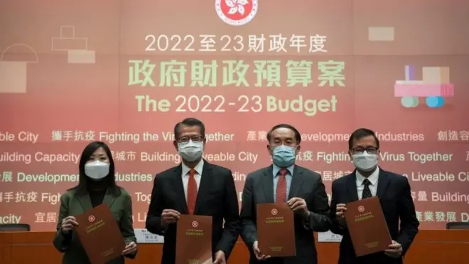 Permanent Secretary for Financial Services and the Treasury Cathy Chu, Hong Kong Financial Secretary Paul Chan, Secretary for Financial Services and the Treasury Christopher Hui and economist Andrew Au attend a news conference on the annual budget in Hong Kong, China February 23, 2022. REUTERS/Lam Yik/Pool