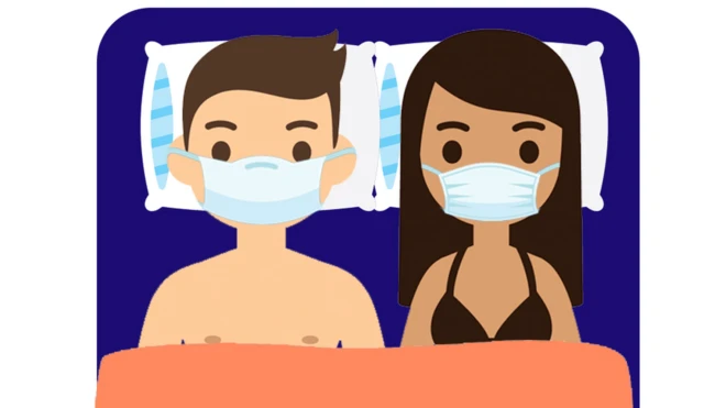 Two people with face masks on in bed