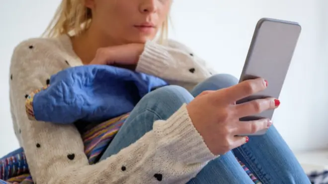 Anonymous girl using a phone