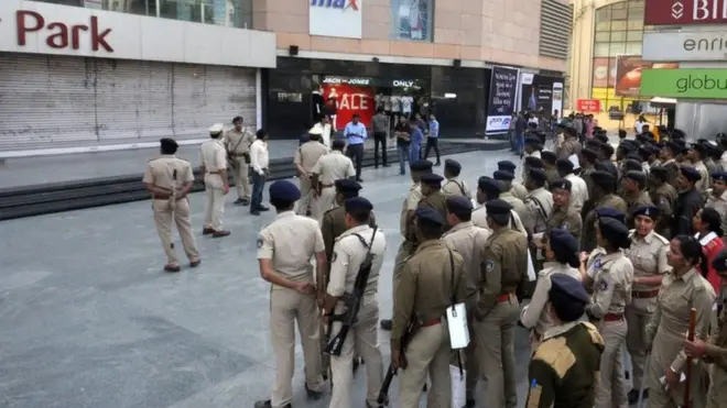 Police were standing guard outside a cinema in Gujarat