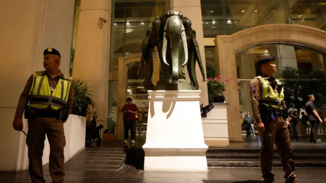 Thai police officers secure the area during investigations after six people were found dead at the Grand Hyatt Erawan Hotel in Bangkok, Thailand, 16 July 2024.