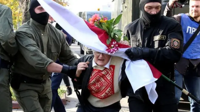 Law enforcement officers detain an opposition activist Nina Baginskaya