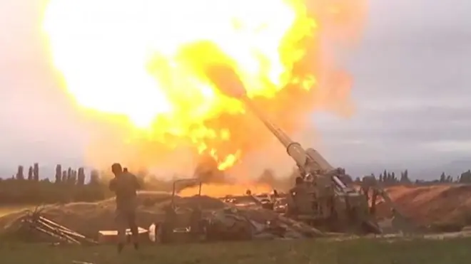 Azeri armed forces firing artillery during clashes between Armenia and Azerbaijan over the territory of Nagorno-Karabakh