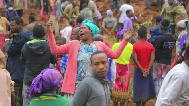 A crowd gathers at the scene of a landslide in Ethiopia