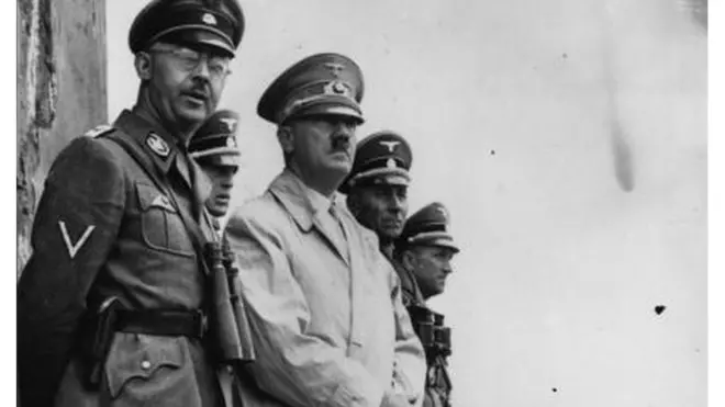 German dictator Adolf Hitler and German Nazi leader and chief of police Heinrich Himmler (left) watching Stormtroop manoeuvres.
