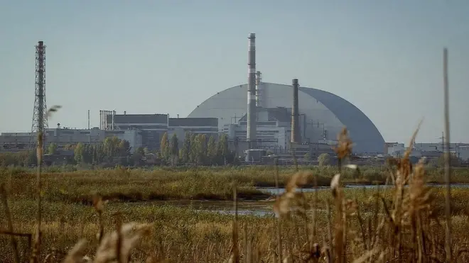 The damaged reactor is now entombed by a steel "confinement structure" as cranes dismantle radioactive remnants within