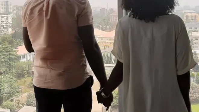 Two friends wey hold hands for Lagos, Nigeria - 05/02/2020