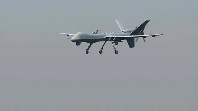 A US drone aircraft lands at Afghanistan's Jalalabad Airport where a US C-130 military transport plane crashed in Jalalabad on October 2, 2015