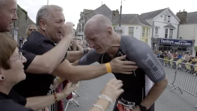 Gareth Thomas completing the triathlon in Tenby on Saturday