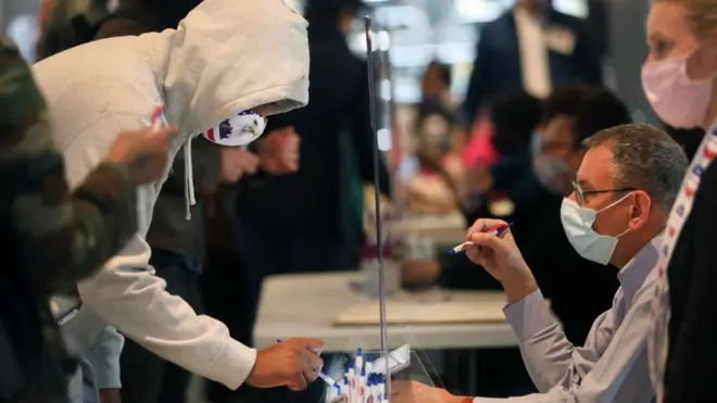 An early voter casts their ballot in New York