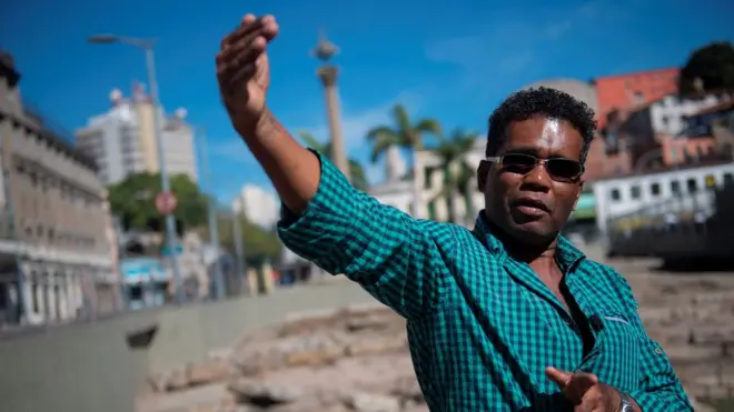 Brazilian Claudio Honorato, a researcher at the Institute of New Blacks and curator of the mass grave site, speaks at the Valongo Wharf, in Rio de Janeiro, Brazil, 28 June