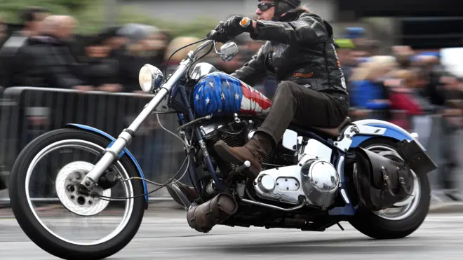 A biker rides his Harley-Davidson during a parade at the "Hamburg Harley Days" in Hamburg