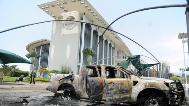 Burnt-out cars outside government building following election protest in Libreville, Gabon, Sept. 1, 2016