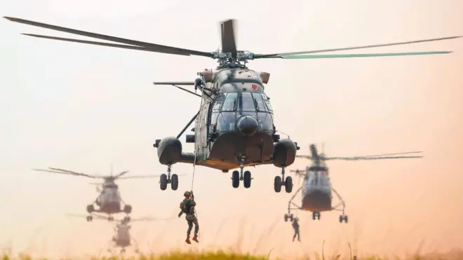 Officers and soldiers conduct aerial landing behind enemy lines during live fire exercises in Fuzhou City, Jiangxi Province, China on November 9, 2025