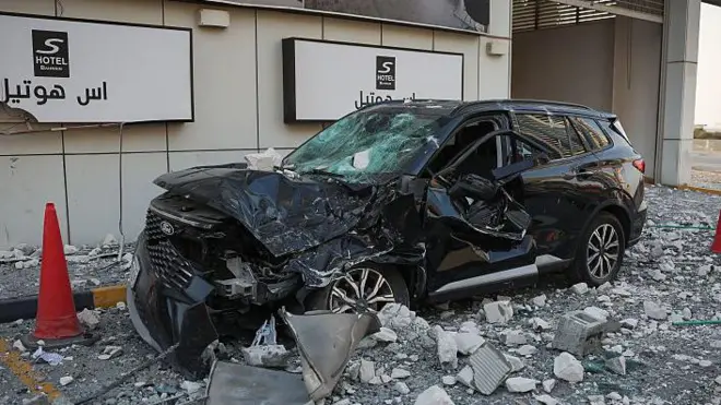 Four people had been wounded by Iranian attacks in Bahrain, one official told the BBC