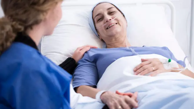 A female patient in a hospital bed