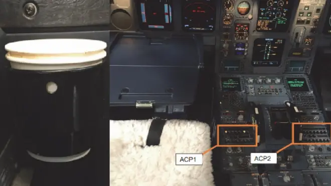 A cup holder (left) and audio control panels (APC) 1 and 2