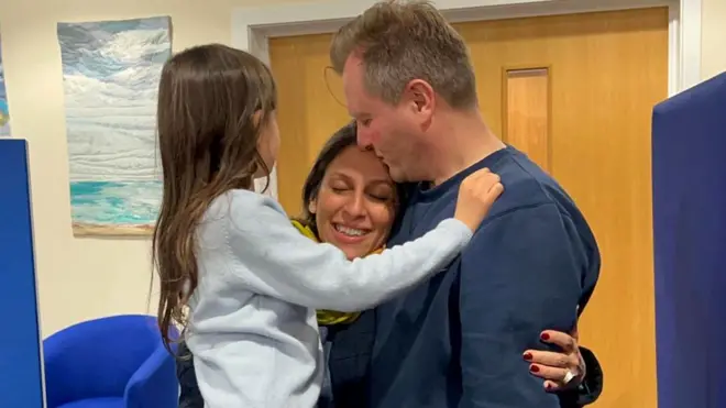 Nazanin Richard and Gabriella hugging at airport