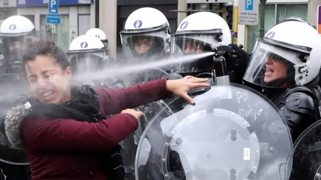 A woman is sprayed with tear gas by a riot police officer during a "yellow vests" protest against higher fuel prices, in Brussels, in December. Reuters photographer Yves Herman said of the woman: "When one young man was seized, a young woman with him rushed towards the line of police, shouting that he had done nothing wrong... She wasn't even wearing one of the fluorescent yellow vests."