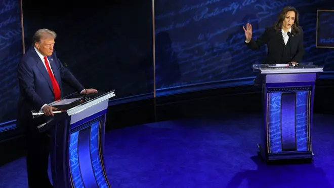 Trump and Harris stand next to lecturns during the debate