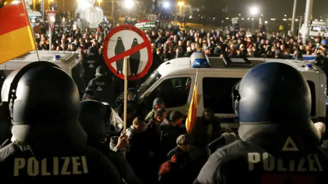 People attend an anti-immigration demonstration organised by right-wing movement Pegida in Dresden, Germany, 19 October, 2015