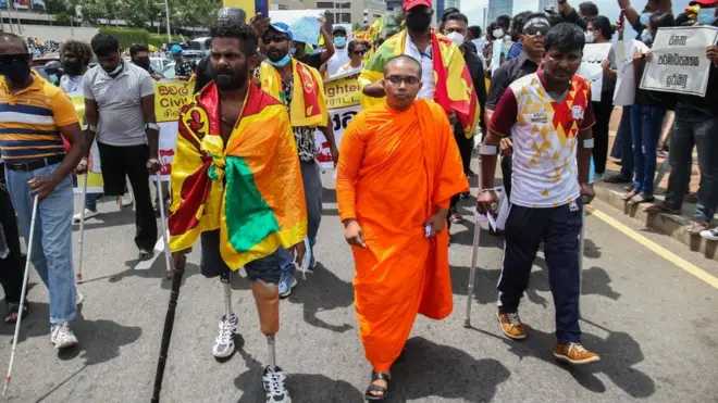 Colombo has seen huge anti-government protests in recent weeks (pictured: retired Sri Lankan soldiers at a demonstration)