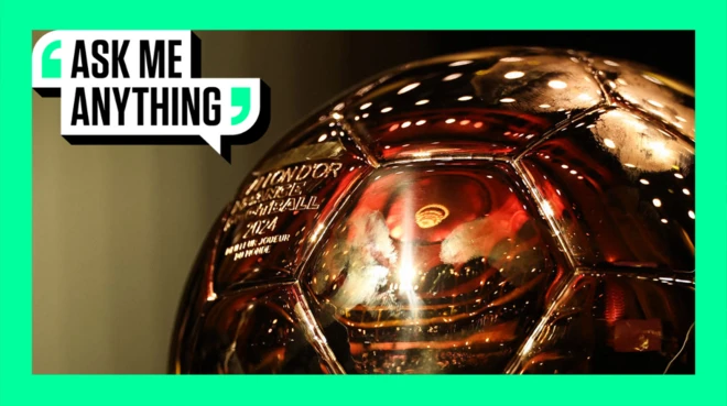 A close-up shot of the Ballon d'Or trophy on stage in central Paris