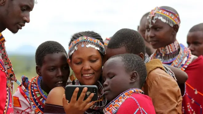 Ethiopian woman looking at phone