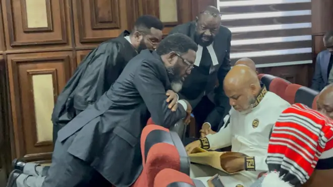 Nnamdi Kanu lawyers surround am for inside di courtroom for di Federal High Court Abuja - 16 October, 2025.