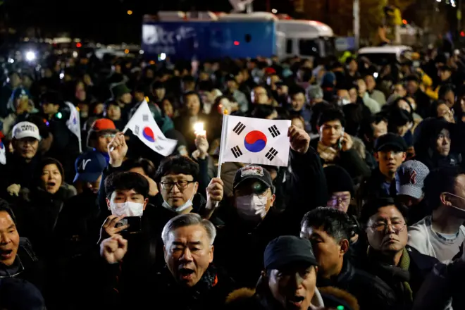 People gather outside the National Assembly, after South Korean President Yoon Suk Yeol declared martial law, in Seoul, South Korea, December 4, 2024. REUTERS/Kim Soo-hyeon