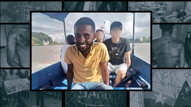 A man in a yellow polo shirt on a small boat on a river looking into the camera lens