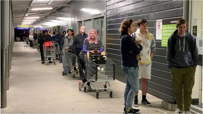 Shoppers were seen queuing at supermarkets after the lockdown was announced