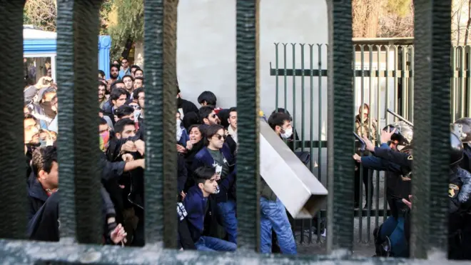 Iranian students clash with riot police during demonstrations against the regime, Tehran, 30 Dec 2017