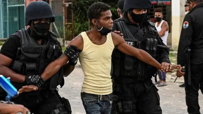 A protester being arrested in Cuba
