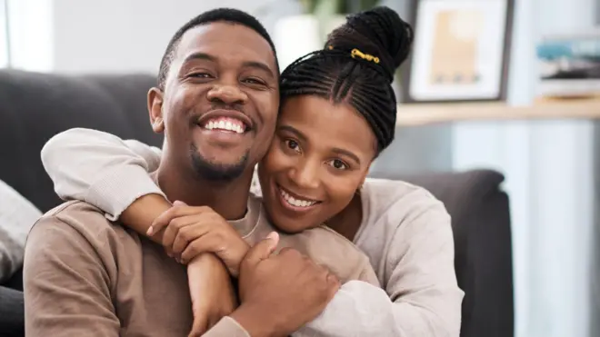 A man and a woman embracing each other