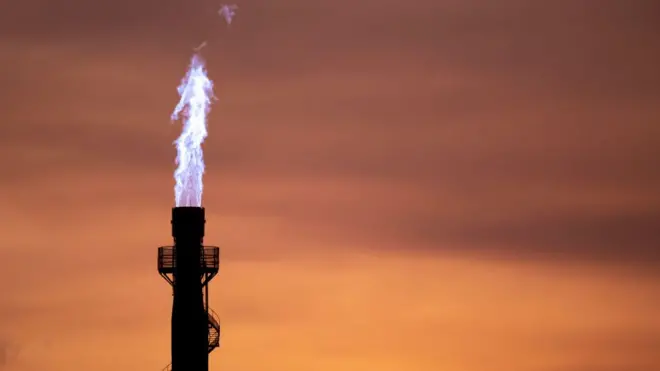 A closeup of flames coming out of a chimney at a Tata Steel plant in Wales