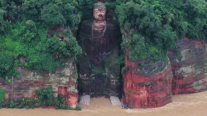 Giant Buddha surrounded by floods