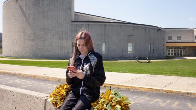 Brandi Levy outside the high school
