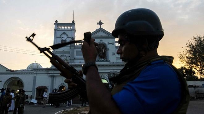 Soldiers stand guard in front of St Anthony's Shrine in Colombo on April 26, 2019
