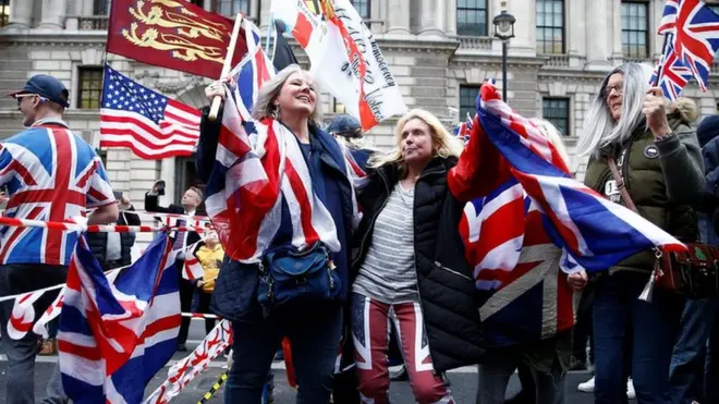 Brexiteers head towards Parliament Square in London. A clock counting down to the moment the UK leaves the EU will be projected on to Downing Street.