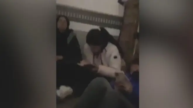 This short video clip sent to the BBC showed the women sitting in the cramped space of a truck filled with banana crates.