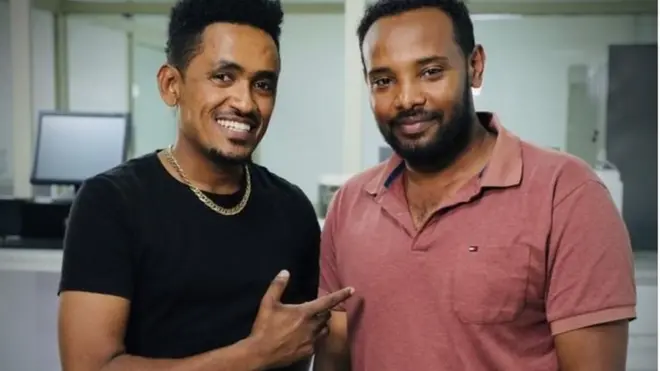 ሃጫሉን ጋዜጠኛ ቢቢሲ (ካሜራማን) ኣመንሲሳ ኢፋ