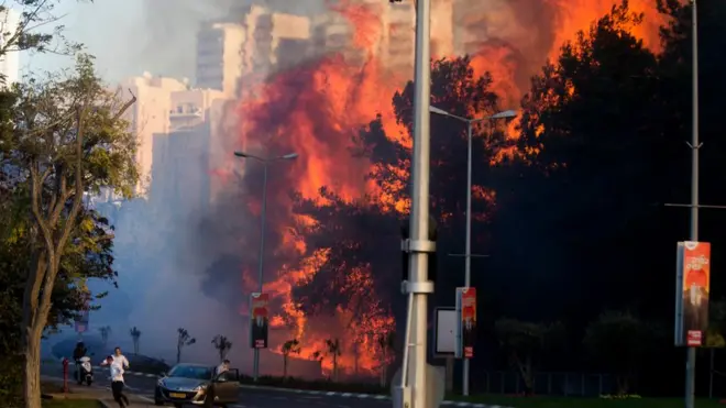 Huge flames roared between apartment blocks as resident fled