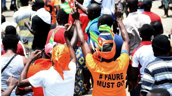 People wey march enter street also wear t-shirt wey massage for President Faure Gnassingbé to resign