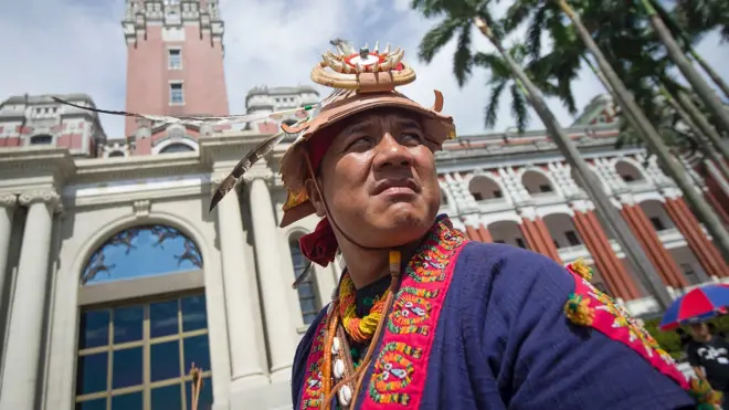 A member of Taiwan"s indigenous population stands in front of the Presidential Office building in Taipei on August 1, 2016