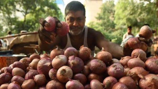 Vegetable vendors sell onions by the road, at Sector 25 on September 24, 2019 in Noida, India.