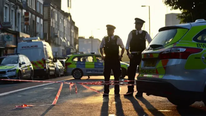 Police officers man a cordon in Finsbury Park, north London