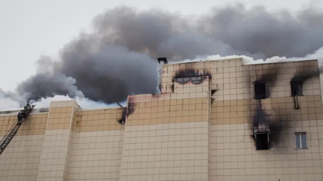 Firefighters extinguish a fire at a shopping mall in Kemerovo, Russia March 25, 2018