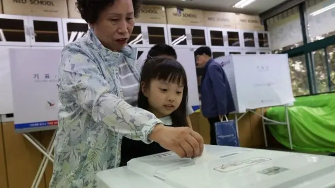 A South Korean woman cast her vote in a polling station on the presidential election on 9 May 2017 in Seoul, South Korea